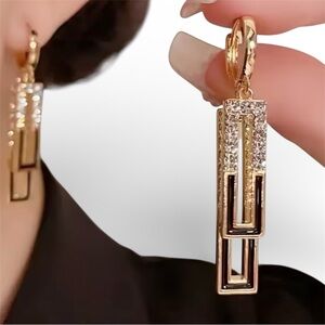 Crafted with an elegance Gold and Black Geometric Drop Earrings